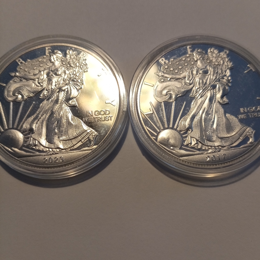 COPY - Two one ounce silver clad collectors souvenir coins in plastic capsules